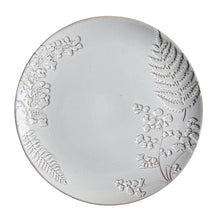 Gray stoneware dinner plate with raised floral and leaf design, embossed rim