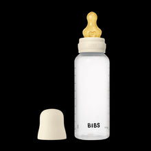 Ivory baby bottle with slow-flow silicone nipple cap and spare nipple