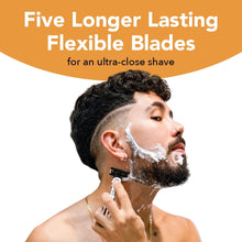 Men's disposable 5-blade razor in use with shaving cream on face