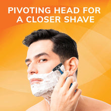 Disposable razor held to a man’s face for close shaving