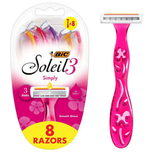 Pink disposable women’s razor with three blades and floral cutout handle