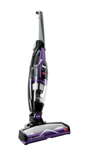 Black and purple cordless stick vacuum with multi-surface brush head and nozzle