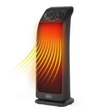 Ceramic tower heater with glowing heat airflow through front grille