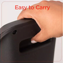 Ceramic tower heater with integrated carry handle on the side