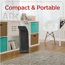 Ceramic tower heater in a compact portable design standing on the floor