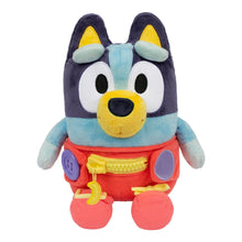 Plush baby Bluey dress toy, dark navy head, light blue top, red overalls, yellow accents