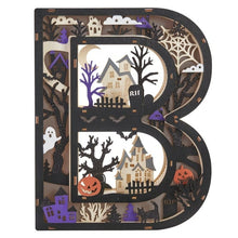 Wooden light-up letter B, dark finish with layered Halloween silhouettes and warm glow
