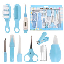 Blue baby care kit with comb, hair brush, nail clippers, and nasal aspirator