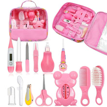 Pink baby grooming kit case with brush, comb, nail tools, aspirator, scissors
