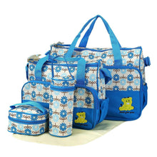Blue diaper tote bag set with coordinated pouches and teddy bear front patch