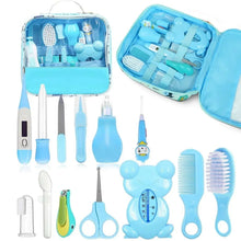 Blue baby grooming kit with brushes, clippers, comb, aspirator, and assorted tools