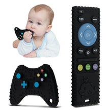 Black silicone chew toys with game-controller texture and remote control buttons.