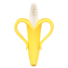 Banana-shaped baby toothbrush teether with yellow silicone body and white bristle top