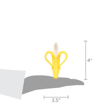 Yellow banana-shaped teether toothbrush with white bristles, 4 in by 2.5 in