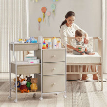 3-tier nursery storage cart with open bin at top, three drawers, and rolling caster base.