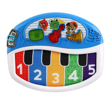 Blue mini electronic piano with animal stickers, green screen, and numbered keys 1–5