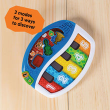 Blue baby music teacher toy with animal notes and number keys on a curved panel