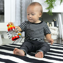 Baby activity rattle with red head, striped handle, and clear shaker chamber