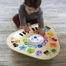Music activity table with colorful icon panel, piano keys, and touch center