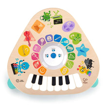Wooden tune table top with piano keys and colorful icon touch panel