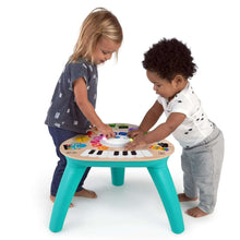 Electronic music activity table with colorful icon panel and teal legs
