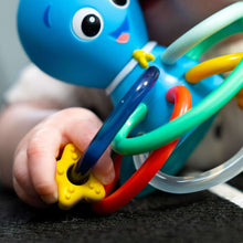 Baby Einstein teether and rattle toy with blue body and multicolor ring arms