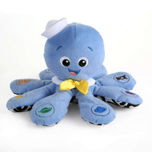 Blue octopus plush toy with yellow bow and smiling face, soft tentacles