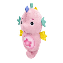 Pink plush seahorse soother with colorful star and fin fabric tags