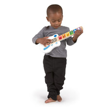 Baby toy guitar, white and blue with colorful animal keys, held by child