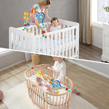 Adjustable crib arch mobile with colorful hanging rings and animal figure toys
