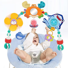Colorful baby stroller activity arch with crab, fish, octopus, and mirror toys