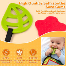 Green and red textured teething pads attached to tummy time mirror toy frame