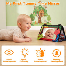 Baby tummy time mirror with open frame, red teether, green handle, facing baby