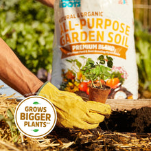 All-purpose garden soil in bag with soil-filled pots and green plants