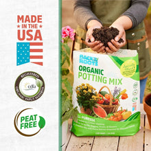 Organic potting mix bag held in hands with USA and peat-free badge panel