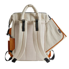 Diaper bag, cream canvas with black accents and front mesh pockets