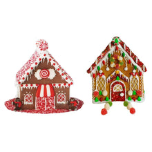 Decorated gingerbread houses, red and green with candy trim and gumdrop accents