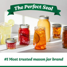 Wide-mouth mason jars with metal lids, filled with fruit preserves in a set