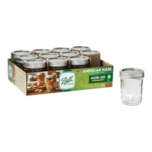 Regular-mouth mason jar with metal lid and band, clear glass