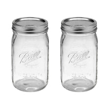 Wide-mouth glass mason jar with silver lid and band, clear quart jar