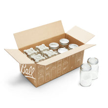 Ball® wide-mouth mason jars with lids and bands in open shipping box, clear glass