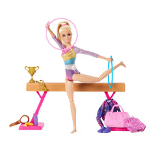 Gymnastics playset doll on balance beam with pink hoops and gym accessory pieces