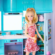 Doll kitchen scene with blonde fashion doll in red floral dress