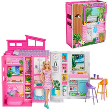 Barbie-style pink doll house with accessories, open kitchen and bedroom rooms