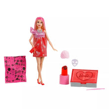 Fashion doll with long blonde hair in pink sparkly dress with makeup accessories and compact.