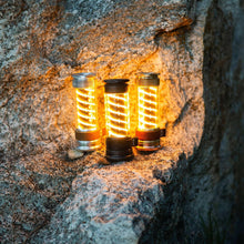 Three Edison light sticks with warm amber glow and silver metal base caps