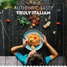 Gluten-free spaghetti dish in blue bowl held by hands
