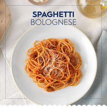 Spaghetti bolognese in a white bowl with tomato sauce and pasta