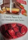 Milk chocolate peanut butter and jelly cups with strawberry jelly center