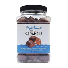 Jar of sea salt milk chocolate caramels with black lid and visible caramel pieces